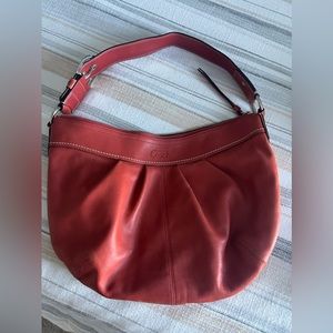 Coach all leather red/orange shoulder purse with silver buckle detail